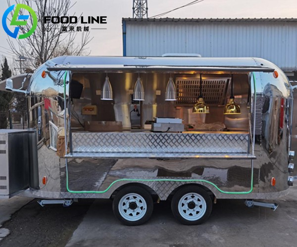 stainless steel towable food truck with a mirror like finish