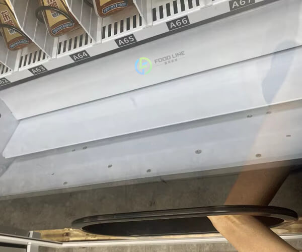 take goods from vending machine outlet