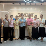 foodline sales staff take photos with mexican client