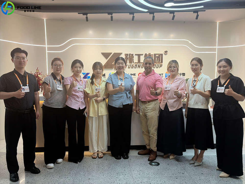 foodline sales staff take photos with mexican client