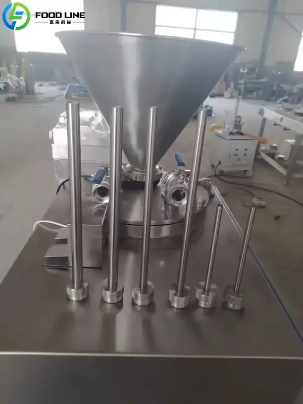 hydraulic meat stuffing machine with multiple filling tubes