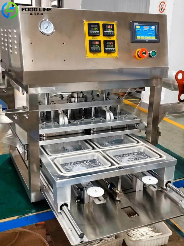 map food packaging machine seals 4 trays per cycle